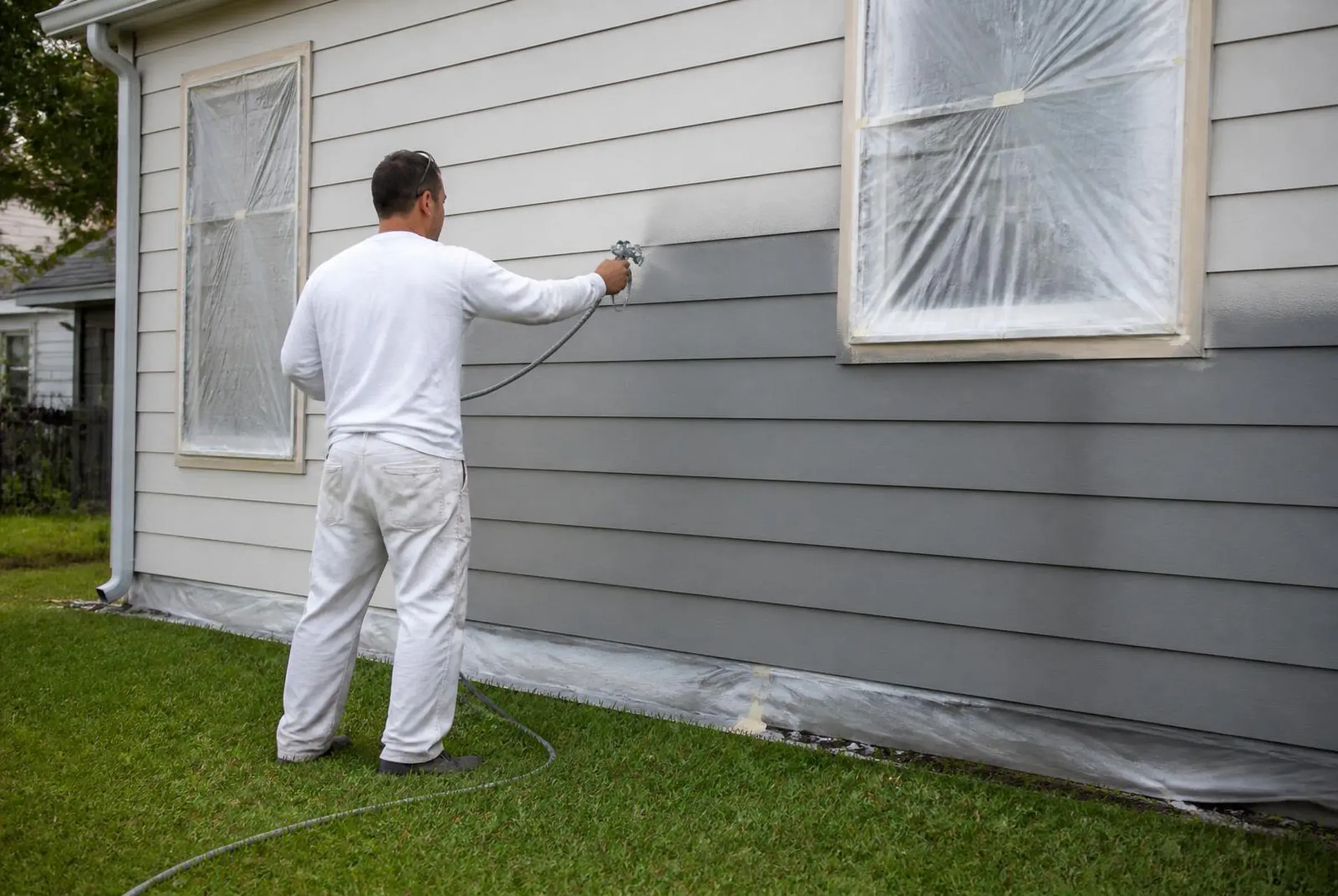 Exterior mid paint job, sprayer in progress